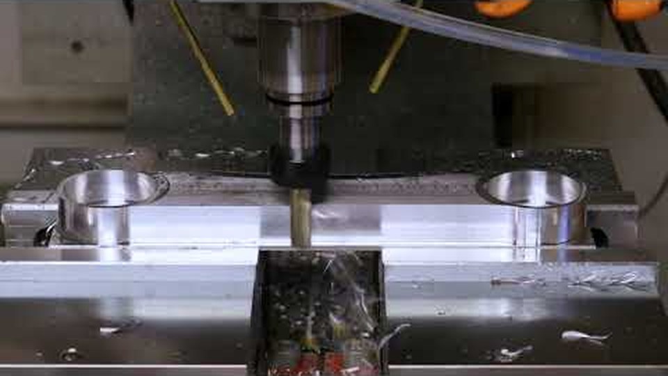 FogBuster coolant sprayer running on a CNC face-milling operation